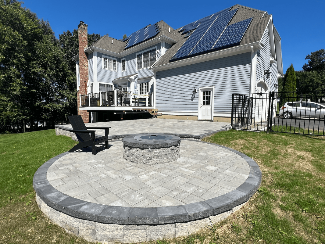 Another angle of our featured image of a fire pit seating area with gray pavers.